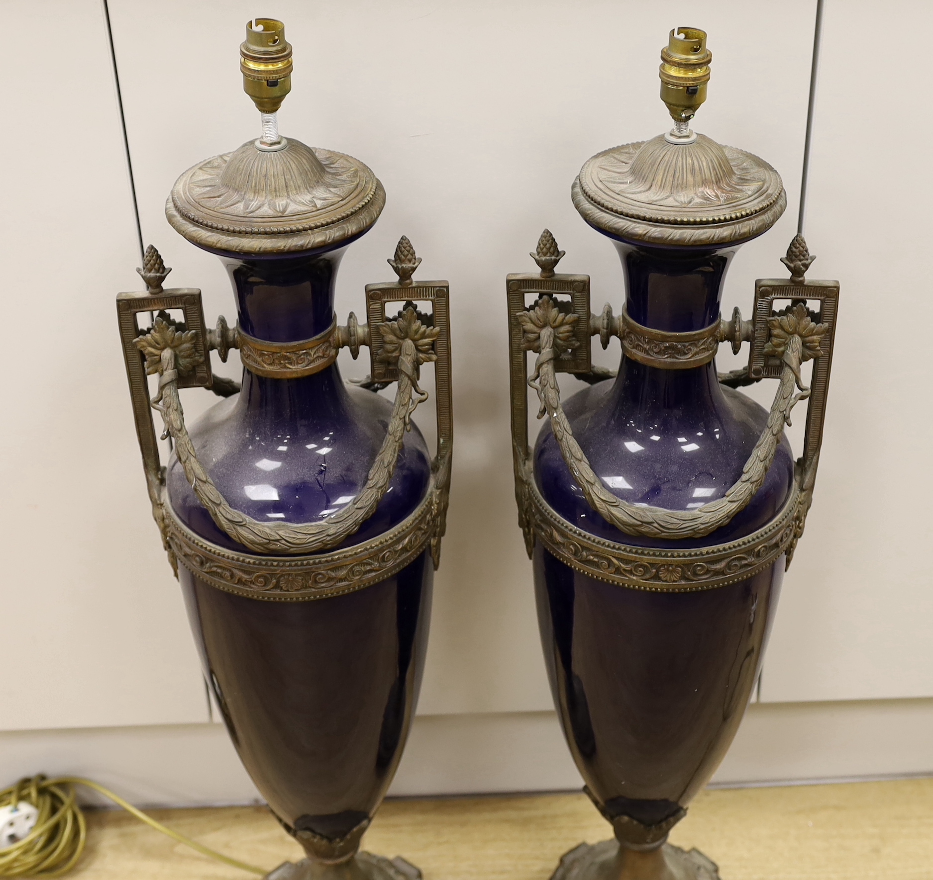 A pair of large Sevres style cobalt blue glazed ceramic lamps with bronzed mounts, 84cm total height